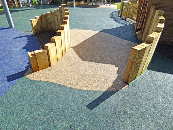 New playground feature made using partial buried vertical oak sleepers