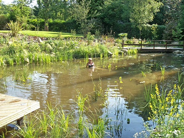 Swimming Pond with customer sitting in the shallows